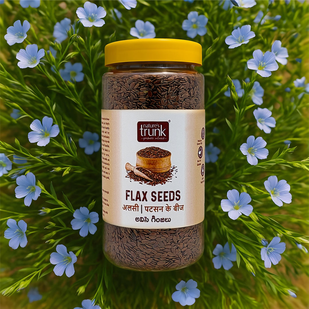 Nature’s Trunk flax seeds jar with fresh flax flowers background, healthy superfood packed seeds, buy seeds online